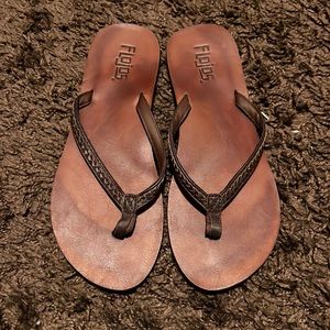 Brown flip flops